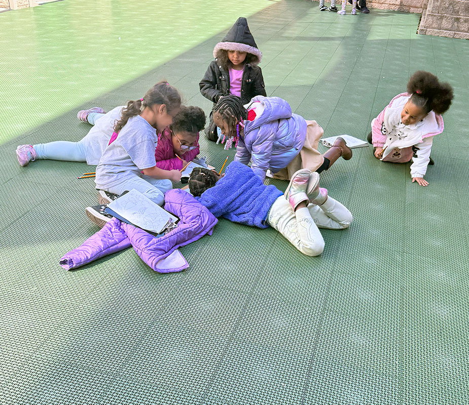 Students work together in the MACS courtyard. Students work together in the MACS courtyard.