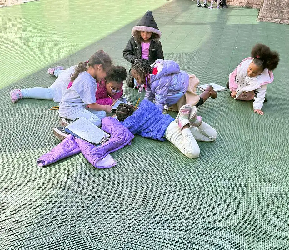 Students work together in the MACS courtyard. Students work together in the MACS courtyard.