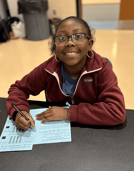 A female academic games student takes an exam.