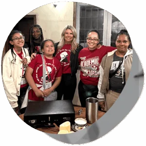 The MACS Academic Games Team posing with two teachers.