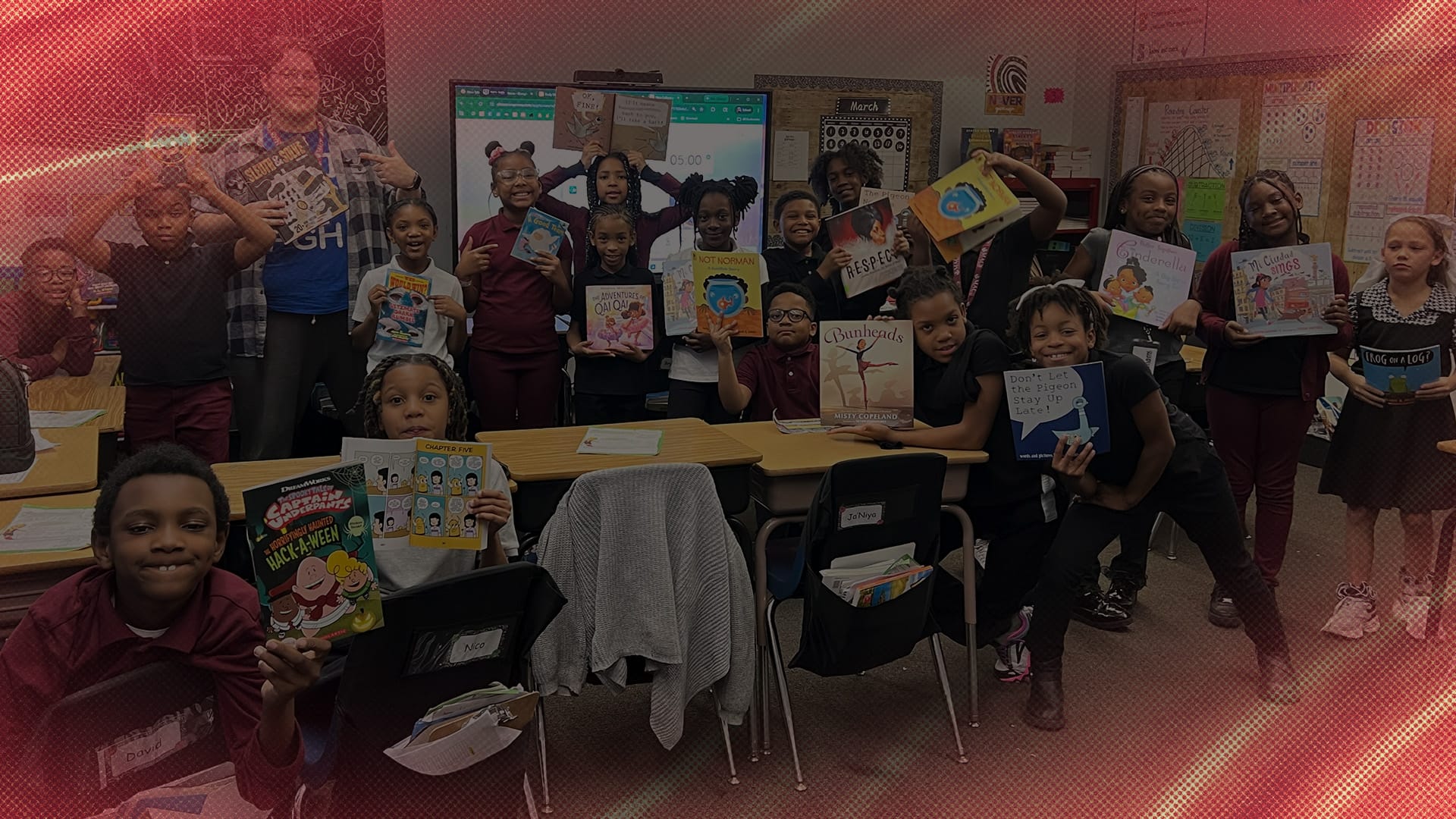 Students pose and show their work.